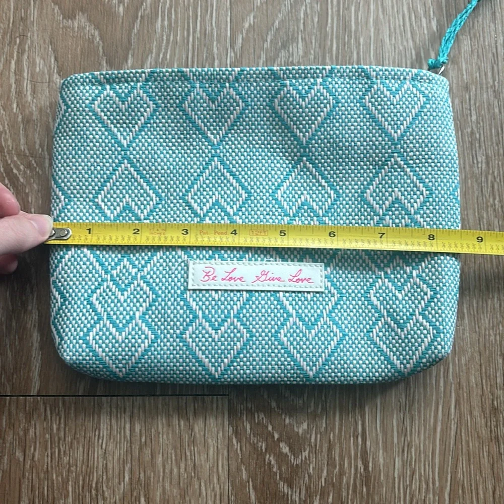 Josie Maran white/turquoise patterned woven cosmetic/makeup bag